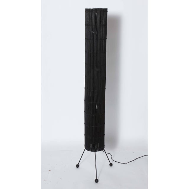 Tall California Contemporary Woven Black Rattan Floor Lamp ,in the manner of Tony Paul for Raymor. Featuring a tall,...