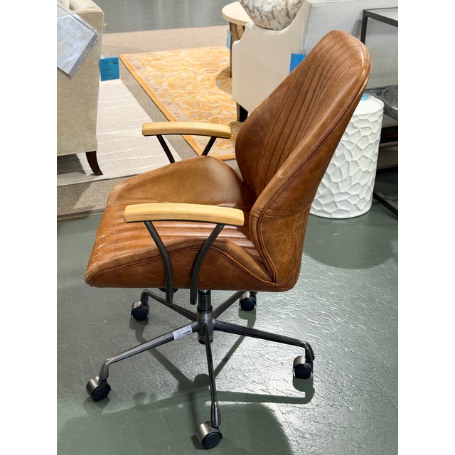 A sophisticated ACME Hamilton task chair combining industrial character with the warmth of natural materials. Upholstered...