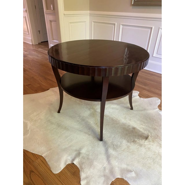 A gorgeously designed fluted-edge, two-tiered entry table by Barbara Barry for Baker. This timeless tables has a hand-...
