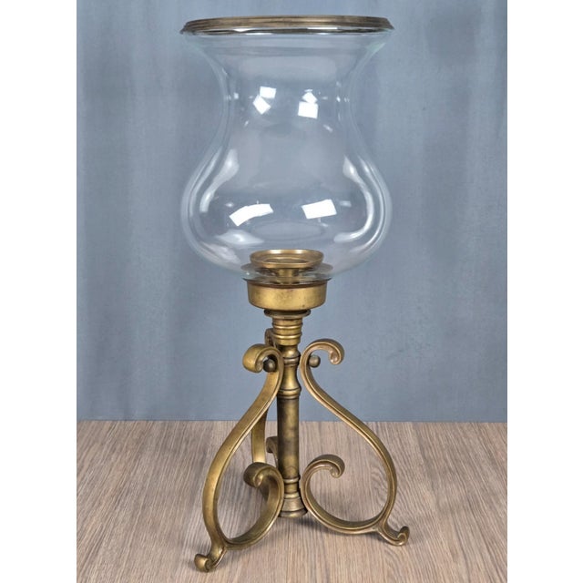 Beautiful, fine craftsmanship and a healthy size. Solid, antiqued brass & glass hurricane candle holder. Classic design by...