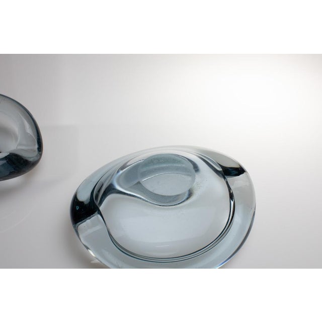 This set consists of two ashtrays from the Akva series from the Danish glass manufacturer Holmegaard. Both were designed...