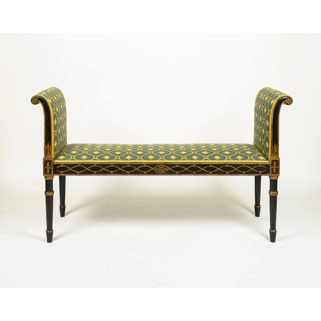 The rectangular seat and outward scrolling arms upholsted in a Neoclassical green and yellow woven fabric; the painted...