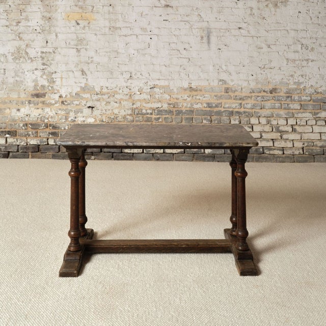 Add timeless French elegance to your space with this 19th century French marble and oak table, a beautifully balanced...