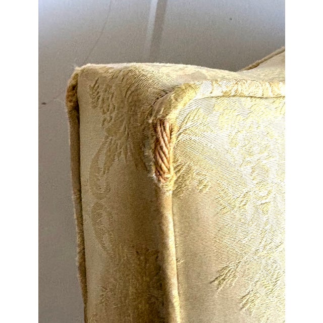 1950s yellow silk damask slipper chair w/ curved wood legs. A couple of threadbare areas at upper corners, and one fabric...