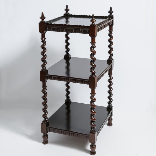 This a charming English Three tier Ebonized Barley, Twist What Not or Etagere This furniture piece is an antique...
