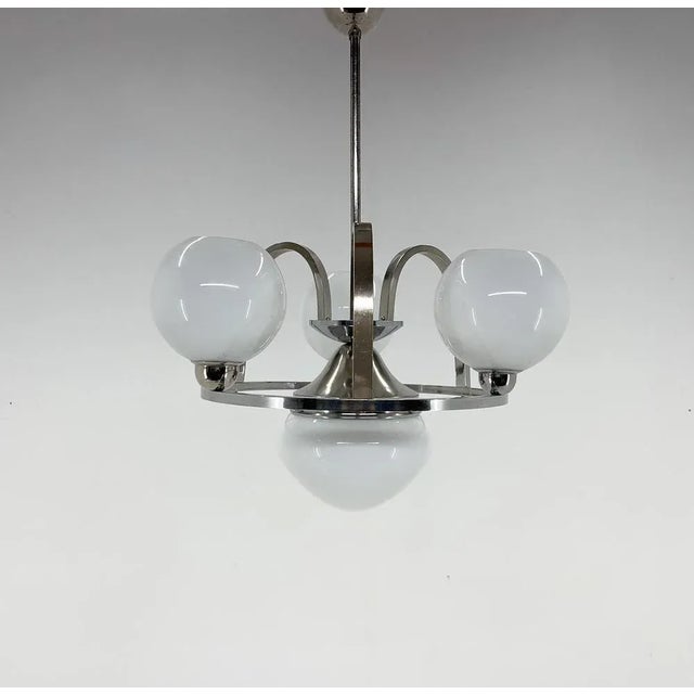 Beautiful art deco chrome chandelier made in the 1930s. Fully restored. Up to 250V (Europe/UK Standard).The wiring of this...