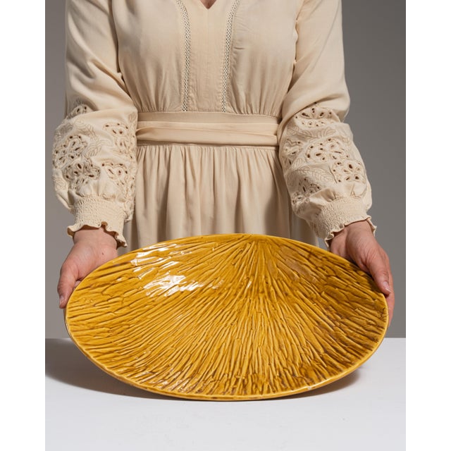 This 1970s platter from Belgium is finished in gold, worked in ceramic. Its form follows honest, well-proportioned lines...