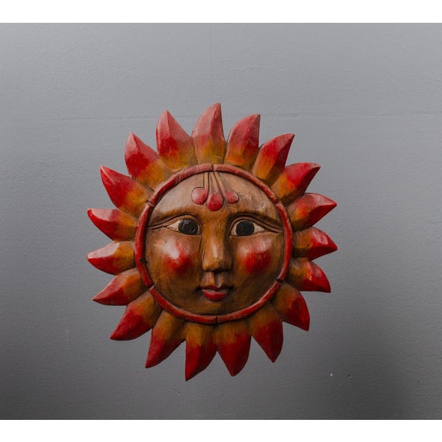 Hand-carved sun with double face. The sun is double-sided, it is handmade work.