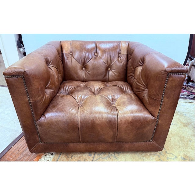 This Restoration Hardware tufted chair is a statement in classic luxury and comfort, perfect for both modern and...