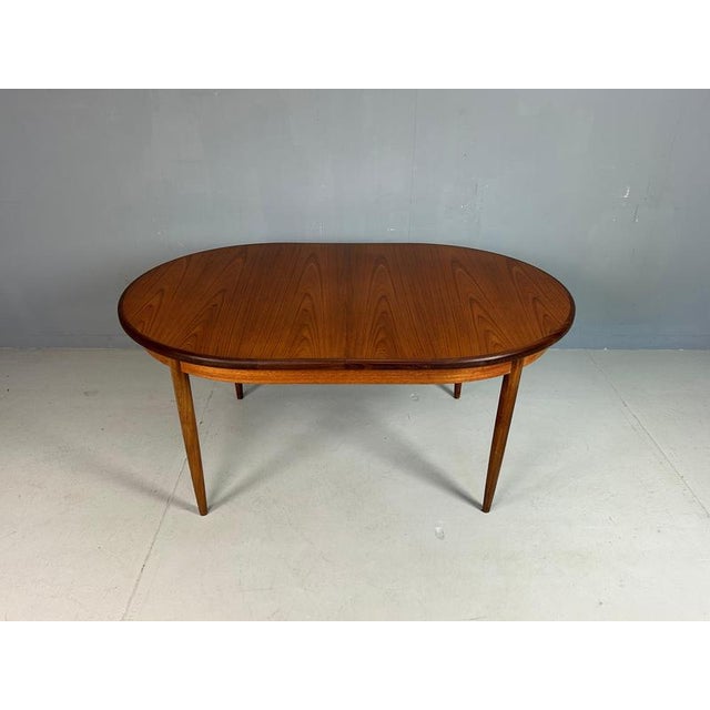 Mid- Century modern period dining room table manufactured and design by famous English furniture maker G Plan, circa...