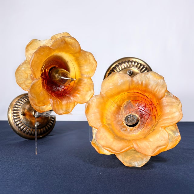 This pair of authentic Feldman Lighting Co. sconces features sculptural 6-inch diameter resin flowers. Verified by the...