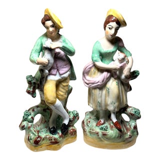 Pair of 1890’s Old Staffordshire Ware England Porcelain Figurines Boy Holding His Dog and Girl Holding Her Cat For Sale