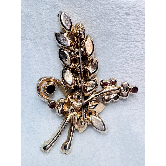 Verified DeLizza & Elster (Juliana) rhinestone floral spray brooch in a beautiful palette amethyst and sparkling Aurora...