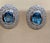 5 Carat Oval Shape Blue Topaz & Diamond Omega Back Clip Earring 14 Karat White Gold Two Blue Topaz weighing approximately...
