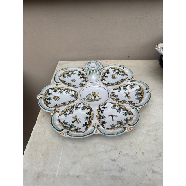 French Faience Swan Oyster Dog Plate Saint Clement, circa 1890. Each shells is decorated with a differents insects,...