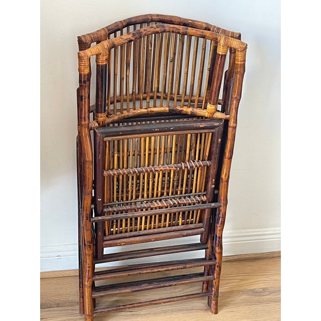 Great vintage pair of bamboo campaign chairs in tortoiseshell burnt finish .