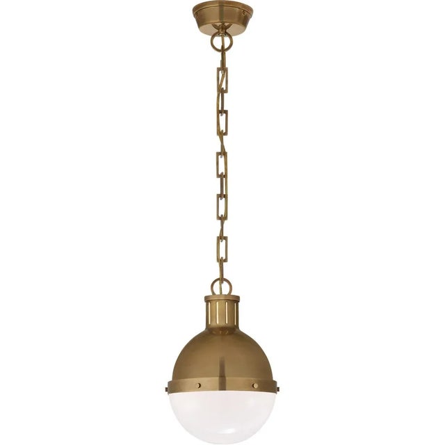 Hicks Small Pendant in Hand-Rubbed Antique Brass with White Glass Designer: Thomas O'Brien Canopy: 4.75" Round Mounting:...