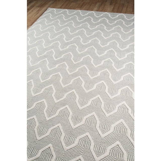 Instill interior floors with a sense of comfortable calm in this decorative area rug collection that conveys a hip hygge...
