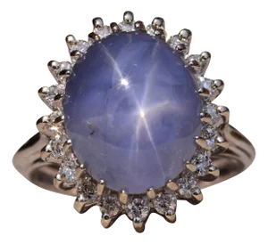 The Asterism: Impressive 12 Carat Star Sapphire and Diamond Halo Ring