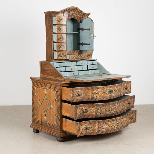 Baroque tabernacle secretary dated 1778, retaining its elaborate original hand-painted exterior and remarkable decorative...