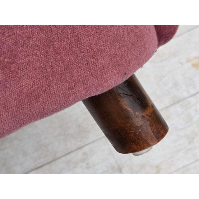 1960s, Danish relax armchair. Pink furniture velour, oak wood legs, brass springs in the seat. Chair was reupholstered by...