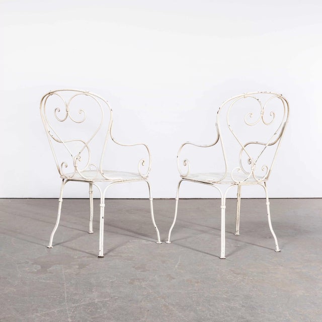 1960’s Pair Of Classic French Garden Chairs with Perforated Seats. Good pair of classic French garden chairs with...
