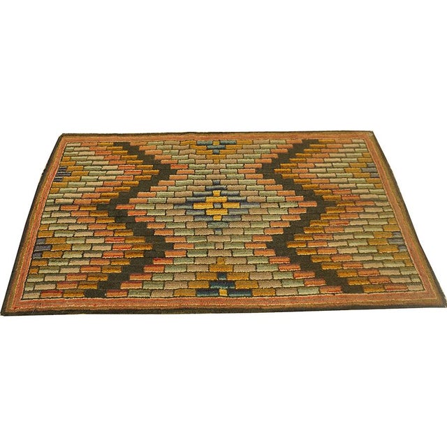 1880 American Hooked Rug 3' 4"x5' 7" This circa 1880 American hooked rug, measuring approximately 3' 4" x 5' 7", is a...