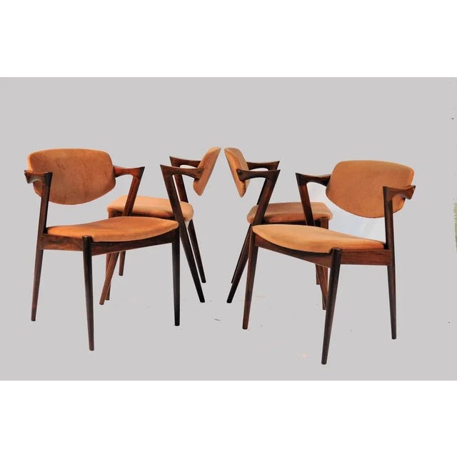Set of eight fully restored rosewood dining chairs with adjustable backrests by Kai Kristiansen for Schous Møbelfabrik....