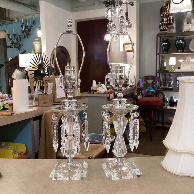 Elegant pair of vintage crystal table lamps featuring faceted crystal bodies, square crystal bases, and cascading prism...