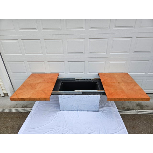 A classic wood and chrome-based dining table designed by Milo Baughman for Thayer Coggin. This piece is expandable but...