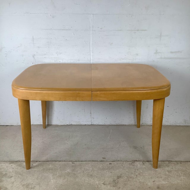 An iconic example of American mid-century design, this vintage Heywood-Wakefield dining table showcases the clean lines...