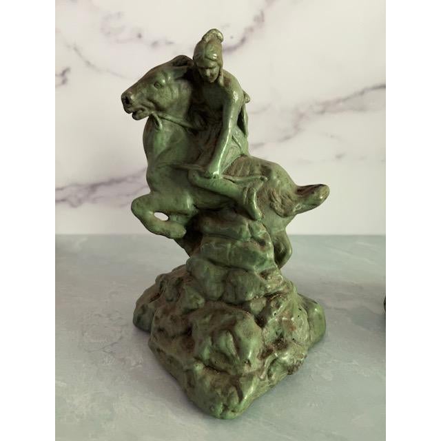 Beautiful pair of bookends by Armor Bronze, circa 1930s. Made of bronze metal. Signed. Depicts Indigenous Native American...