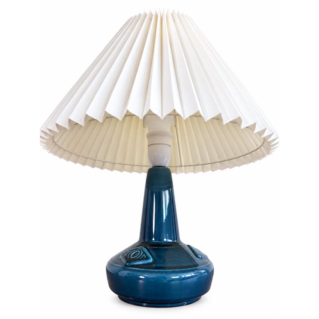 Elegant vintage Danish table lamp dating from the 1960s, featuring a sculptural ceramic base finished in a beautiful deep...