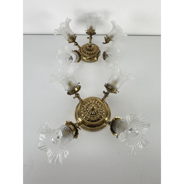 Set of 2 adjustable ceiling lights (4-5 lights) in brass and Murano glass, 1960s The two ceiling lights have a brass frame...