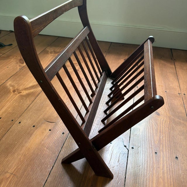 This wonderful vintage MCM Danish teak magazine rack from the 1960s is a stylish and functional décor piece. Its sleek...