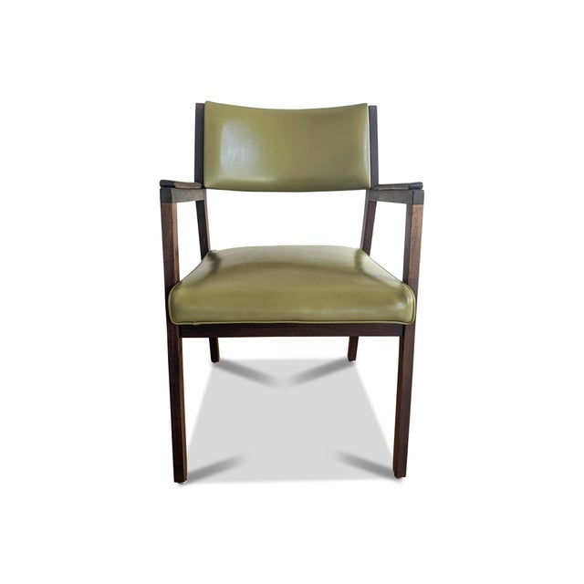 A striking avocado green office chair made by the Alma Desk Company. The vintage side chair has a rich walnut frame with...