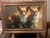 This is a detailed oil painting featuring two Pembroke Welsh Corgis captured in a classic, realistic style. The artwork...