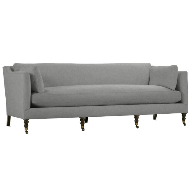 Bench seat sofa resting an four turned legs eding in casters. Includes two lumbar pillows, Spot clean as needed Looking...