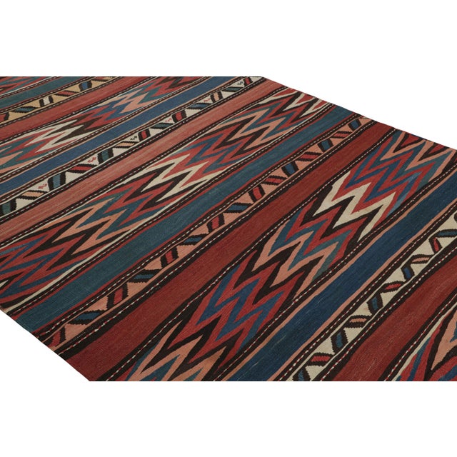 Handwoven between 1950-1960, this vintage midcentury 6×14 wool Kilim was discovered in Turkey, enjoying a Shahsavan...