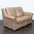 This Bradington-Young loveseat offers comfort and style with its soft tan leather upholstery and classic nailhead trim....