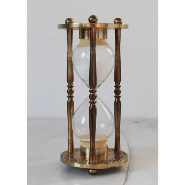 Vintage solid brass hour glass or sand timer featuring Roman numerals. No makers mark. Minor age wear.
