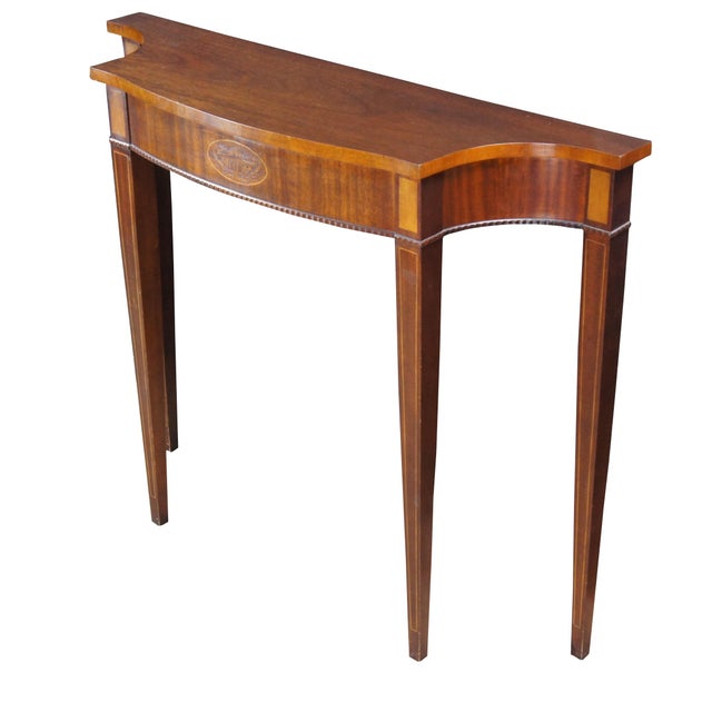 1970s American Federal Style Demilune Console Table, attributed to Councill Furniture. Features a shapely mahogany frame...