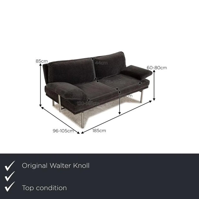 The Living Platform sofa by Walter Knoll is covered with a gray fabric and stands on silver metal feet. The minimalist...