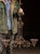 Ornate cast iron chandelier featuring a three-arm configuration with elaborate Gothic Revival detailing throughout. The...