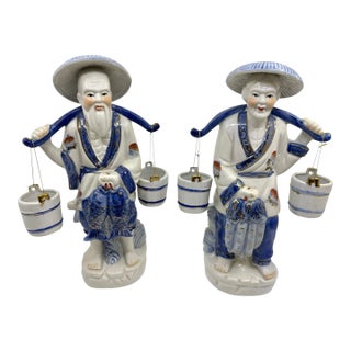 Blue and White Asian Man and Woman Fishing Statues- A Set For Sale