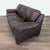 3 seat sofa with plush cushions and brown leather upholstery. Brand: Natuzzi. Dimensions (in): 84W x 35D x 29H.