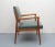 Elegant 50s armchair. Elegant construction made of solid cherry wood. Related in synthetic leather, color military kaki....