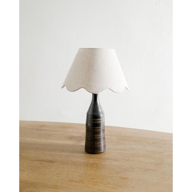 Rare and early Swedish mid century brown ceramic stoneware bottle lamp with a beautiful decorative hand made decor by...