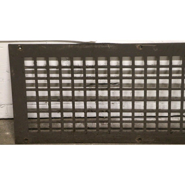 Reclaimed rectangular black steel grate. The original mounting screws are not available. Good condition with surface wear...