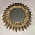Italian vintage sunburst mirror with backlight. Gold leafed embossed tole rays adorning a circular central mirror. The...